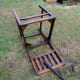 Chair on lawn being deep cleaned with a pressure washer.