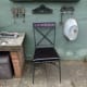Using the two spare reupholstered seats with the two iron patio chairs I bought cheaply from a dump; for added comfort.