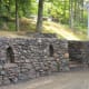This wall in West-Bolton, near Brome Lake, QC, was built using field stone from the customer's and neighbouring property. Six feet in height and well over a hundred feet long. I was pleased that the customers allowed me to insert some arches.