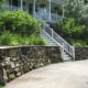 The mossy stones make the wall look as though it's been there for years, but with a new clean look from the Penn Blue capping.