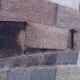 Working the broken shingle upper half out.