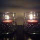Red candles in a jar with clear water beads.
