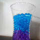 Colored layers of water beads.