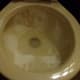 sprinkle baking soda ll around the top part of the toilet bowl