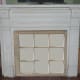 Multi-paned window over closed off fireplace