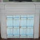 Blue shutters covering closed off fireplace