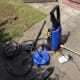 The big blue round object is the compact patio and decking cleaner. Also, the bottle attachment (which fits onto the handle and filled with cleaner) when used for car washing.