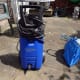My Nilfisk C110.4 on my patio, with a blue bag of accessories to the right; the bag not supplied by the manufacturer.