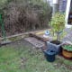 Bricks set into the lawn and cemented down.