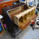 The assembled unit (pigeon-holes, beading spacer and decorative trim) placed on the writing desk area; ready to push back and secure in place.
