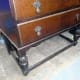 Front stretcher between the legs that prohibits easy storage below the bureau.