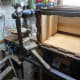 Using a wooden mallet to gently separate the joints so as to remove the stretcher.
