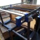 Clamping the legs tightly together after gluing them, while the glue to set overnight.