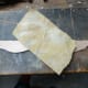Hand sanding the edges of the newly cut decorative trim to round them off and make them smooth.