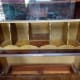 Pigeon-holes unscrewed and removed to reveal writing desk panel doesn’t go the full depth of the bureau e.g. the back of the top drawer is visible.