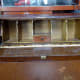 Decorative trim removed from the pigeon-holes to reveal gap between top of pigeon-holes and the top of desk.