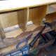 Tacking the beading and decorative trim in place, to the top of the pigeon-holes, with glue and panel pins.