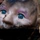Some little girl once loved this doll. Now she is discarded and forgotten. She looks surprised to be covered in filth. "I used to be somebody."