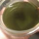 Liquid oil right after simmering, dark in colour but still clear enough to see through
