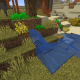 A small farm grows around a stream of water in a village.
