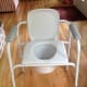 A portable toilet can stand alone or be adjusted and placed over an actual toilet.