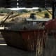 The dumpster inside the north warehouse. Make sure you destroy that explosive tank before other enemies do that for you.