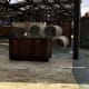 The dumpster inside the north warehouse. You can cover most of the area from here.