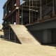 You'll see this ramp to the left of the parked Grangers. Use it to get up to the first floor.