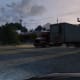 Make a right here when you see the trailers . . . or at least its trailers in Free Roam... might be containers in the mission . . . Yeah, just make a right at this point.