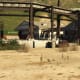 Take cover by these cement barriers when you get to the depot. Make use of the explosive obejects around the area.