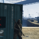 Take cover behind this green container here.