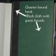 Example of quarter-bound book. Cloth is in black and boards are green. (graphic by AMB)