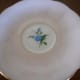 The saucer showing the forget-me-not design underneath.