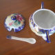 It comes with a little porcelain spoon.