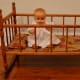 "Nancy" in my doll cradle.