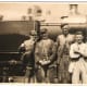 Loco cleaners pose on an engine at Caerphilly, Wales