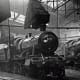 Taunton, mid-Somerset had a GWR shed, code 83B. Here, looking spick and span, a GW 43XX tender loco class 2-6-0 rests under the smoke extractor