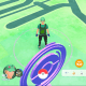 An invaded Pokéstop in the background.