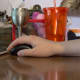 Keep your wrist flat and your forearm well on the desk while at the computer.
