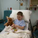 Snuggled in the hospital gurney with a heated blanket, just before going into surgery.