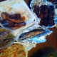 an array of seafood, meat, and veggies