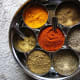Spices, including cumin, cayenne, tumeric, and corriander.
