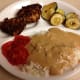Fatty foods, such as fried meat, may trigger symptoms. The gravy is also a fatty food.