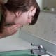 Once you're done, take your mixture of hydrogen peroxide and water, and swish it gently around your mouth. Make sure you spit it all out, and then gargle and spit with clean water to make sure you get everything out of there.