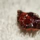 This is a raw cut piece of garnet. Its blood red colour makes it highly popular with jewellery makers.
