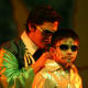 The Wizard of Oz whispers something to the Tin Man (for the kids musical theater)