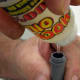 Hold the shock body over your jar when filling, so any spills go in the jar.