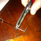 Step Two: Slip the pushrod tip over the pushrod and crimp it tightly with a crimper (pliers work well too).