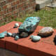 Pretty rocks displayed on a garden wall.