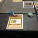 This meeple holds a legendary tome.